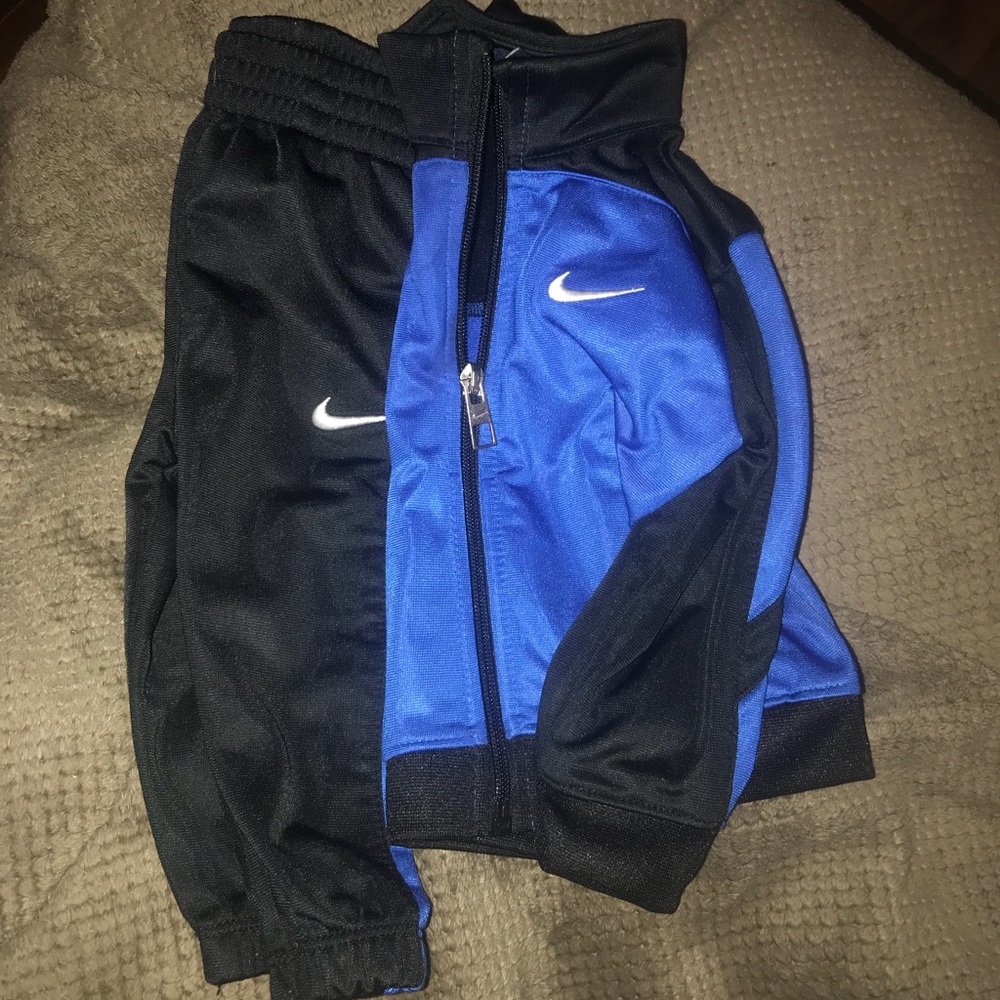 Little boys matching Nike track suit.